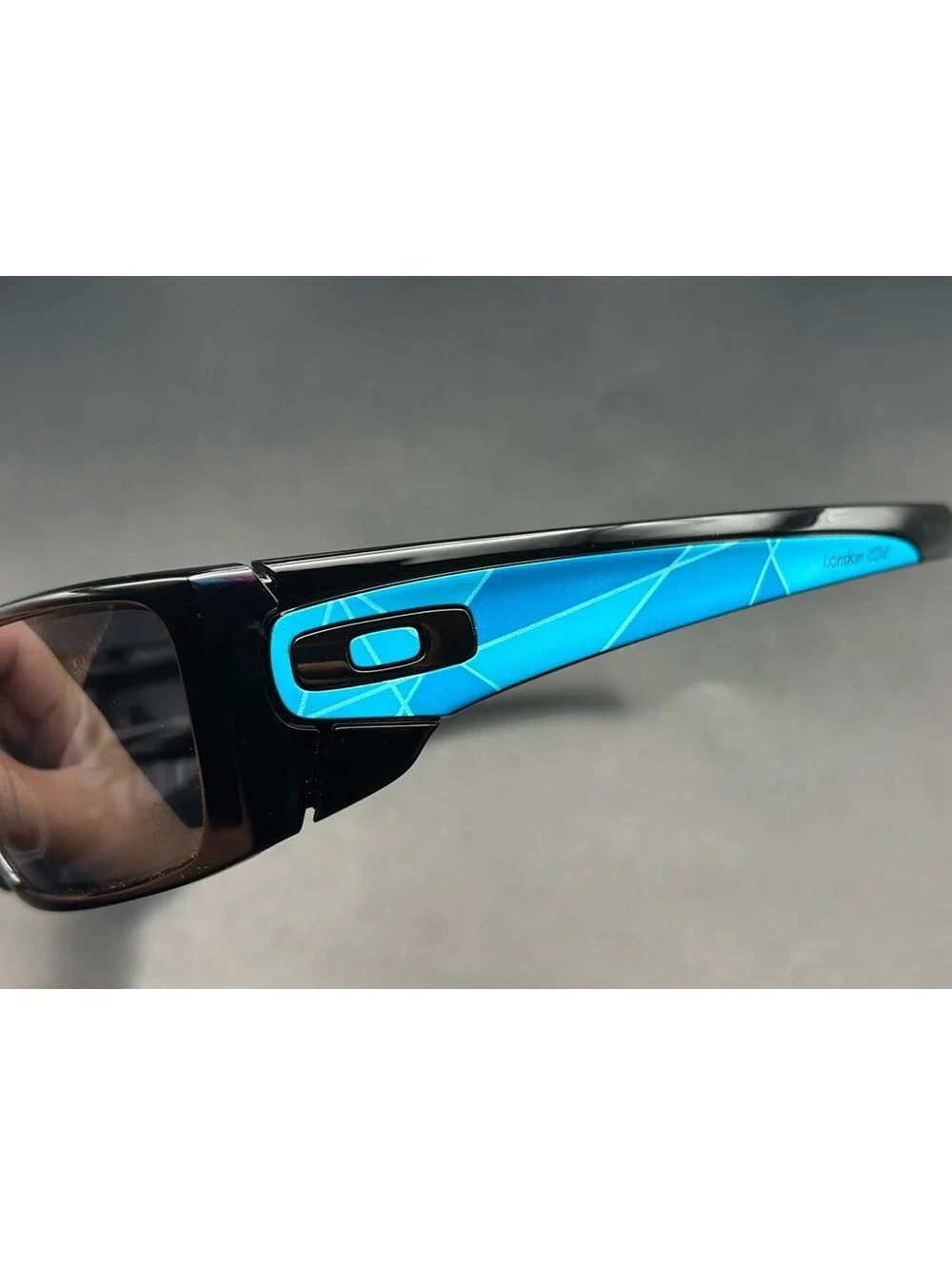 Oakley Fuel Cell LOCOG Polished Black/Black Iridium Lenses OO9096-59